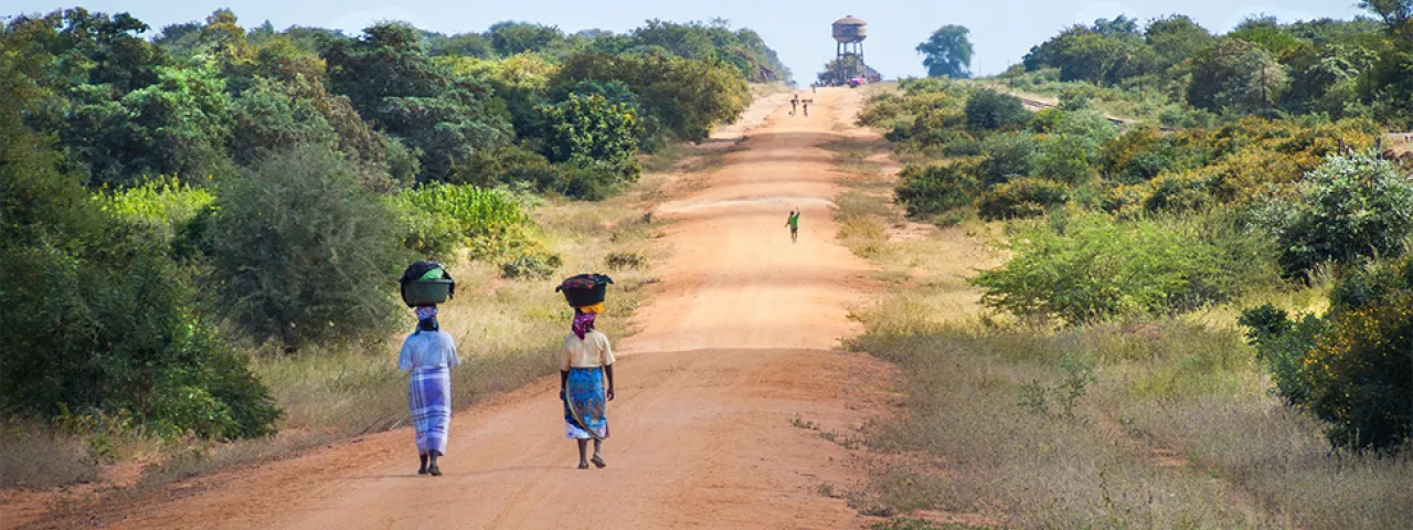 African women walking on a road