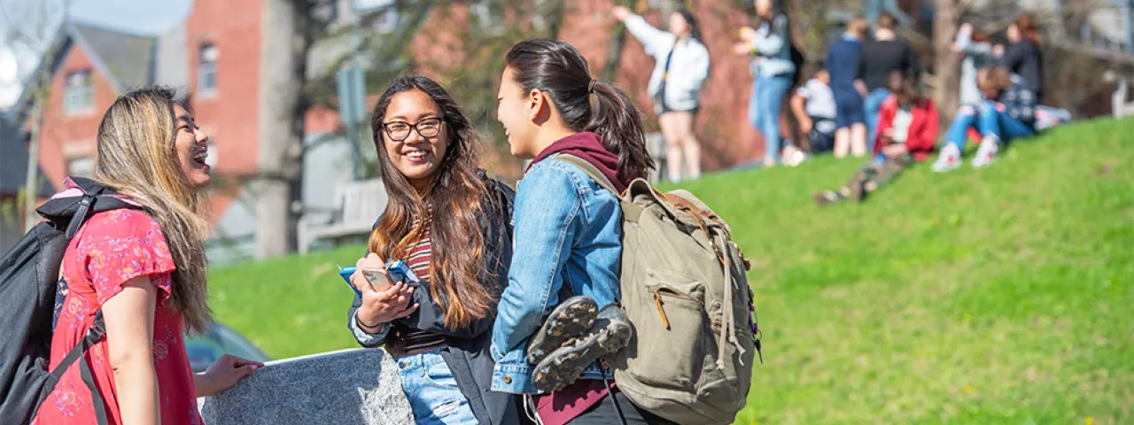 Group of students talking on campus