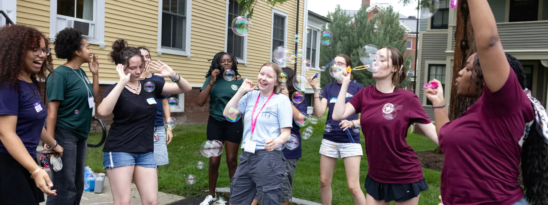 Student leaders dance around blowing bubbles on Move-In Day, 2026