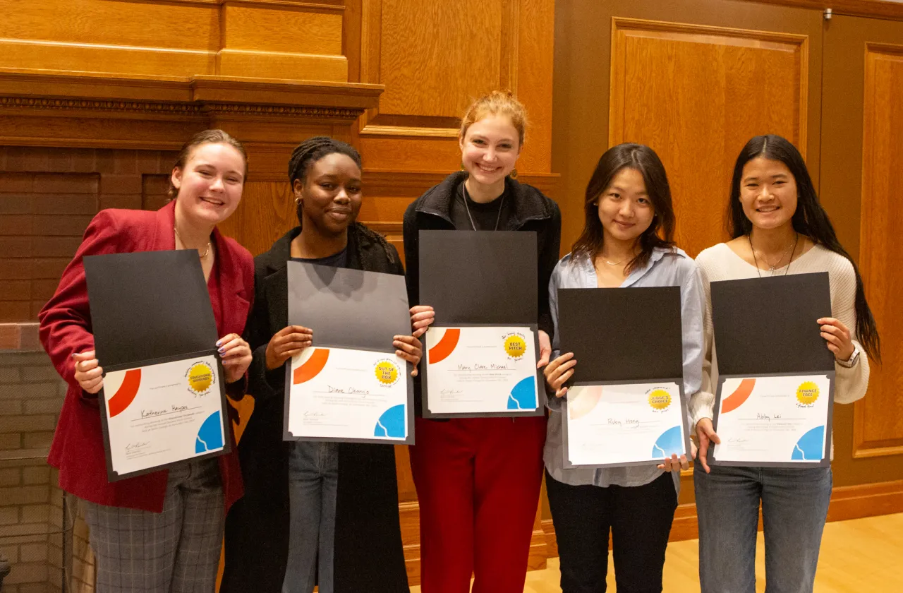 Pitch contest winners pose with their certificates.