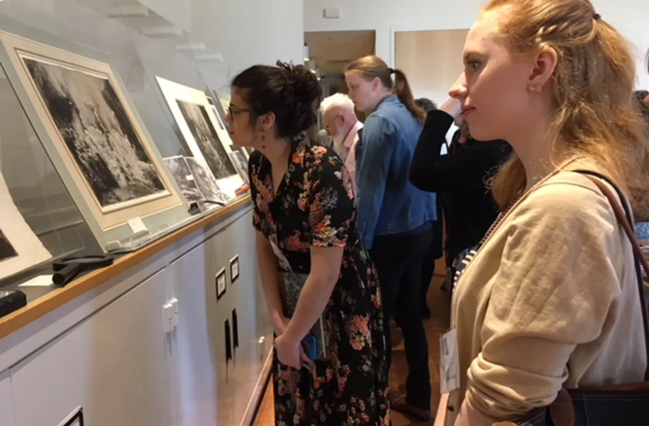 Maddy Greaves'18 (left) and Amanda Bolin '18 do some close looking at three rare Rembrandt prints during a study session at the Smith College Museum of Art.