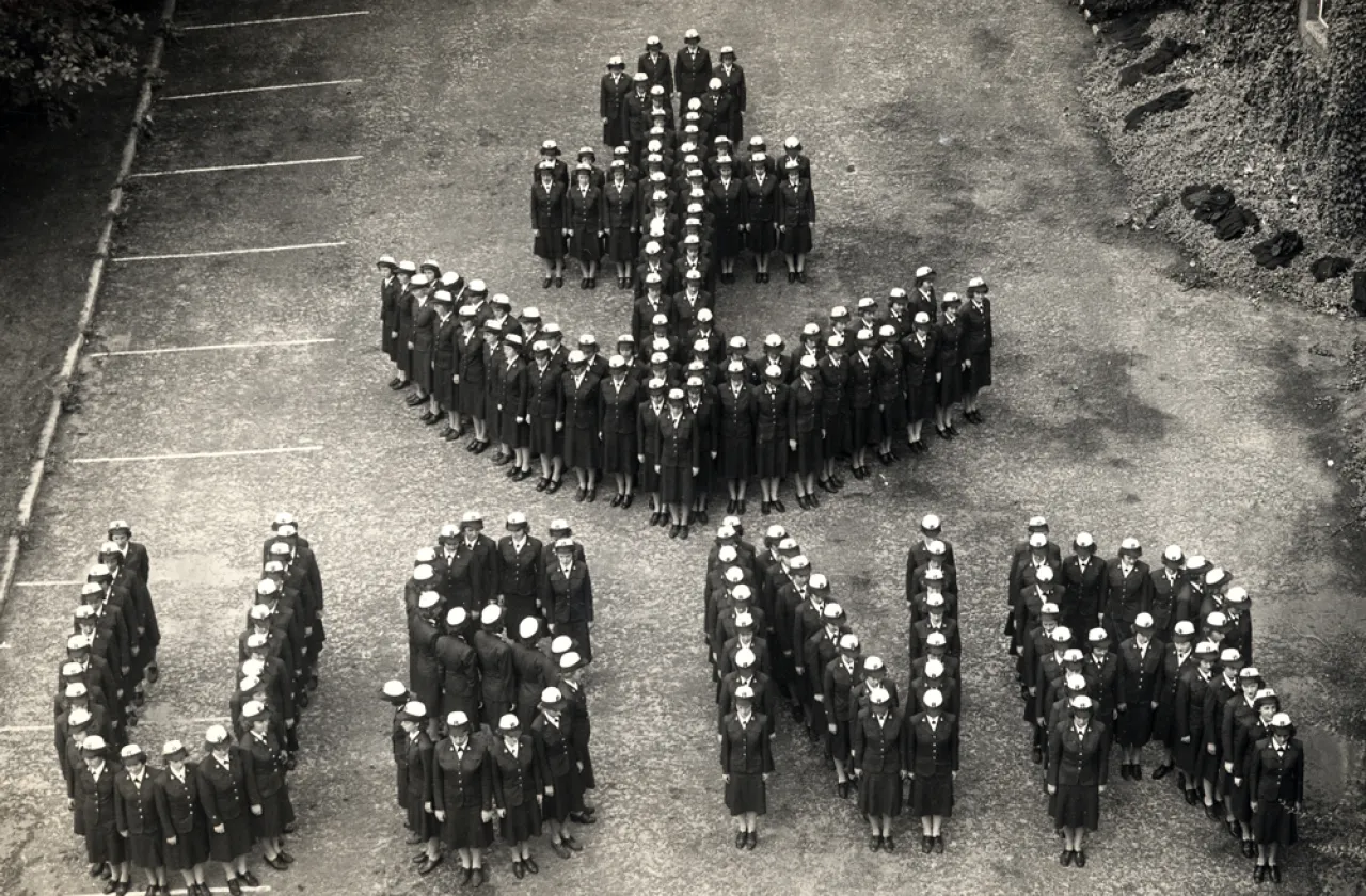 WAVES standing in the shape of USNR and an anchor