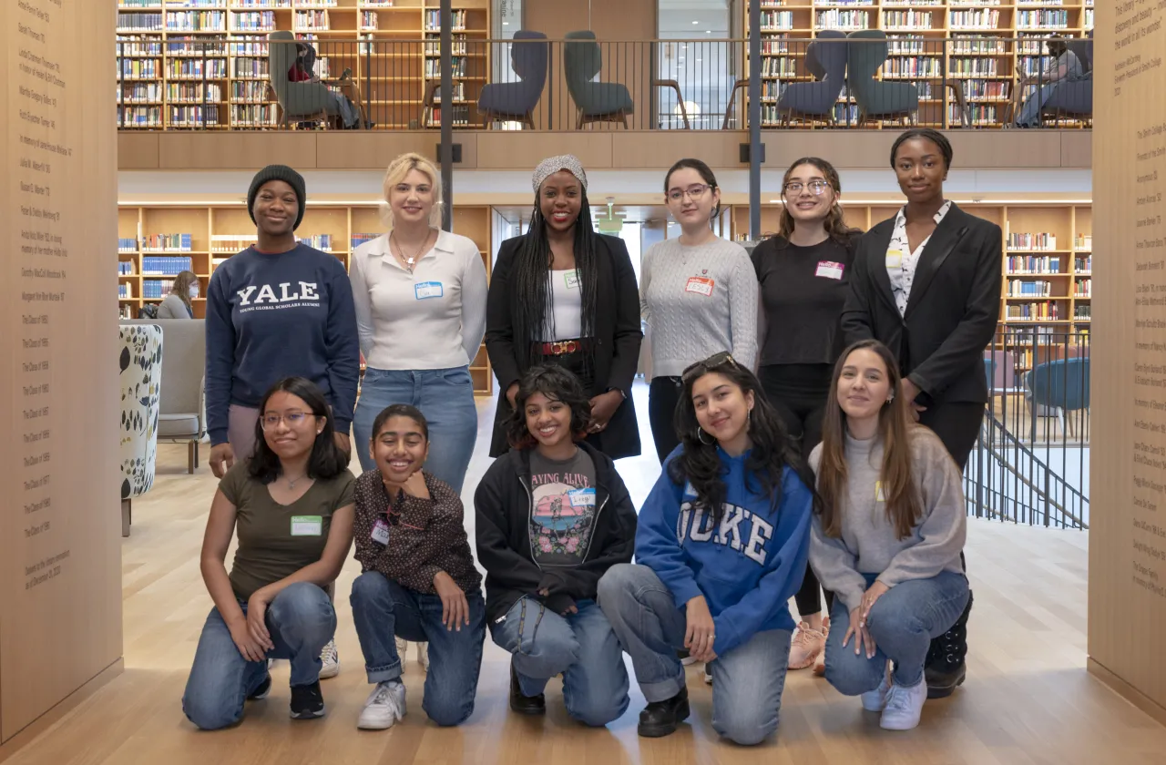 Students participating in Smith's new Money Menntors program pose for a group shot in Neilson Library