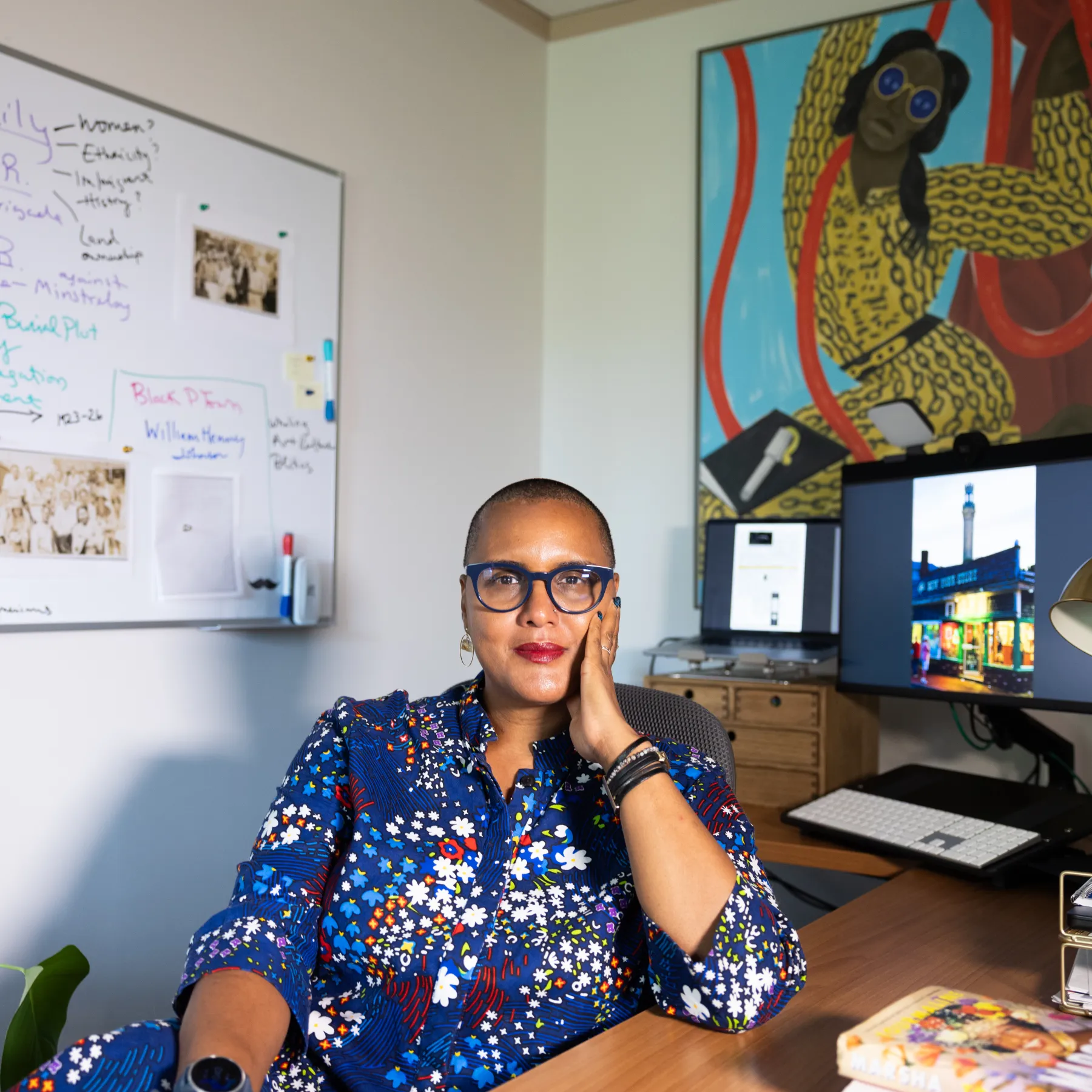 Crystal Fleming sits at her desk in her office.