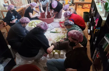 Students slicing vegetables to make kimchi