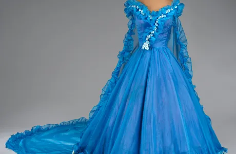 Long, blue, frilly dress with short sleeves and a train.