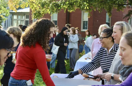 President Sarah handing out donuts on Mountain Day