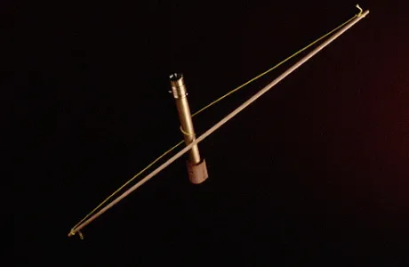 A metallic body with taut, elegant string