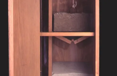 Open wooden cabinet featuring two compartments