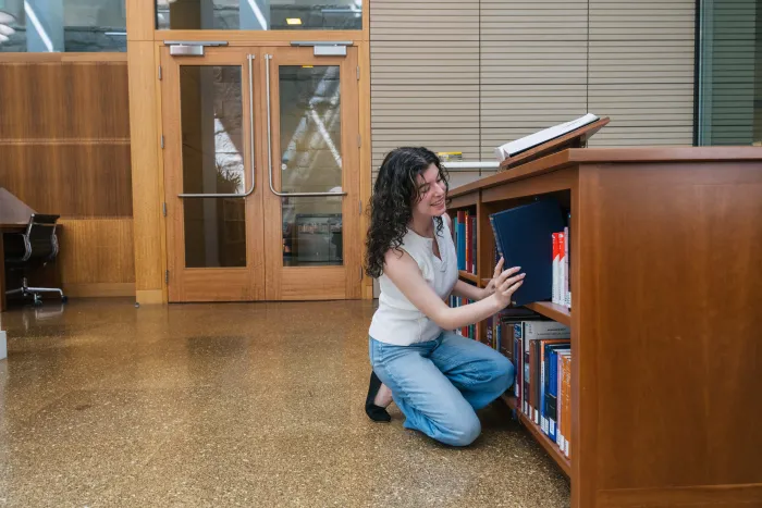 Tallulah Costa '25 interning at the Berkeley Law School Library. She has since earned a fellowship with the Center for the Study of the Presidency and Congress. Photo by Darius Riley