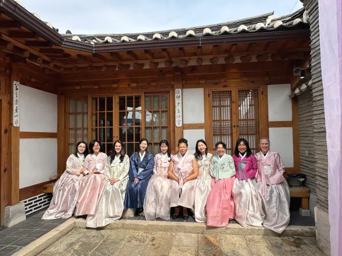President Sarah Willie LeBreton and Smith College alums wearing traditional Korean clothing.