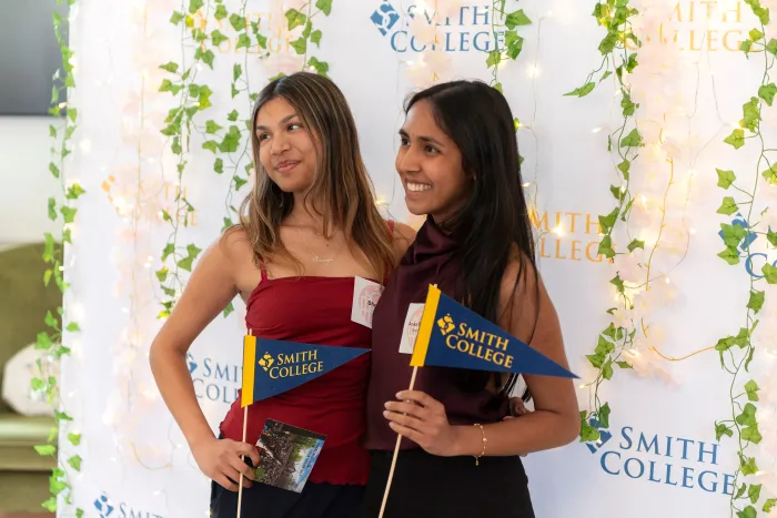 Students pose in a photo booth