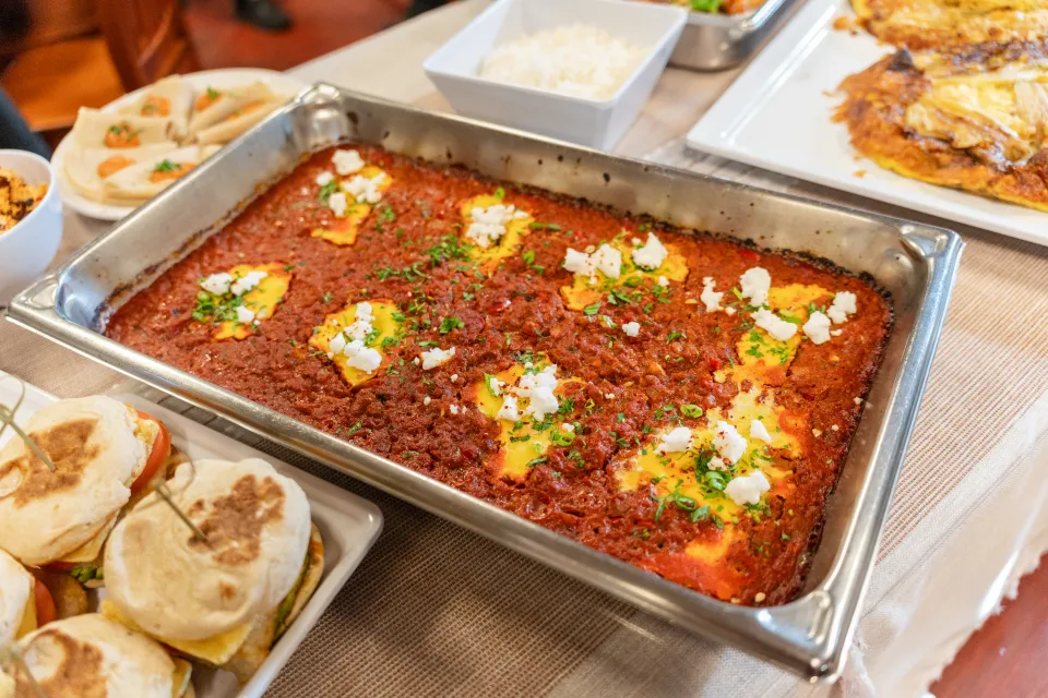 A tray of spicy chorizo shakshuka with Better 'n Eggs in tomato sauce