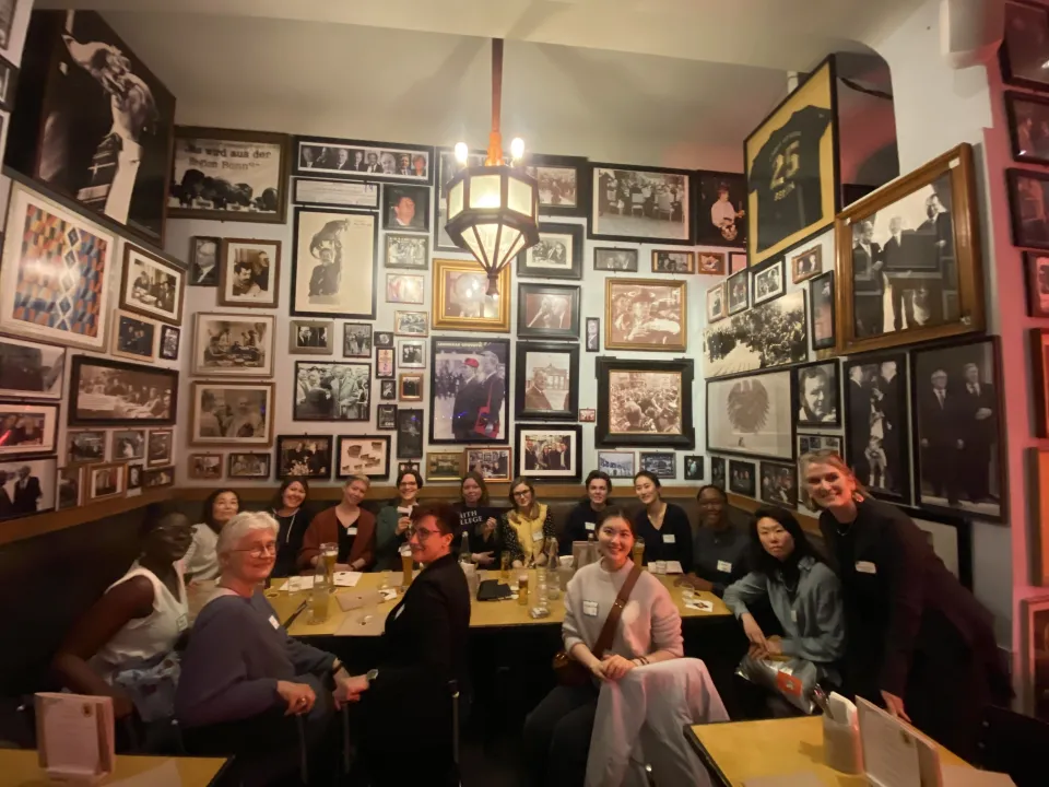 People gathered around a table in Berlin, Germany