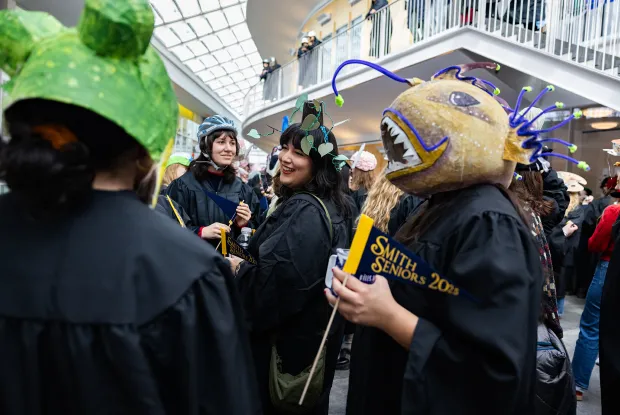 Students in the Campus Center for Rally Day. One is wearing a hat made to look like an angler fish.