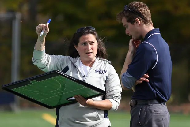 Smith College coaches discuss strategy on the field